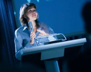 Woman at Podium